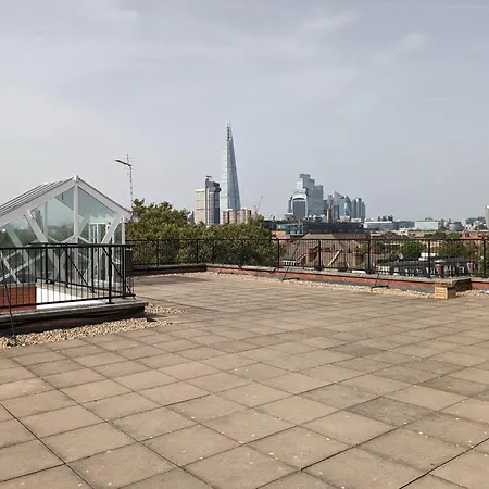 High-ceiling Flat With Rooftop & Skyline View Apartment