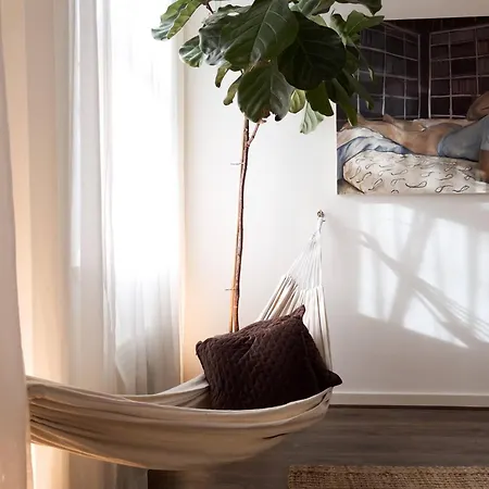 Tranquil Oasis W 100inch Cinema & Hammock, By The Design Traveller London