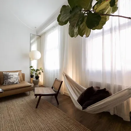 Tranquil Oasis W 100inch Cinema & Hammock, By The Design Traveller * London